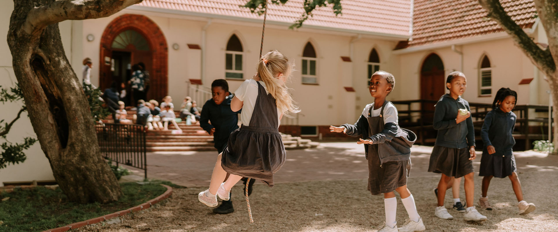 Children playing at Three Peaks School on the Holy Trinity Church grounds